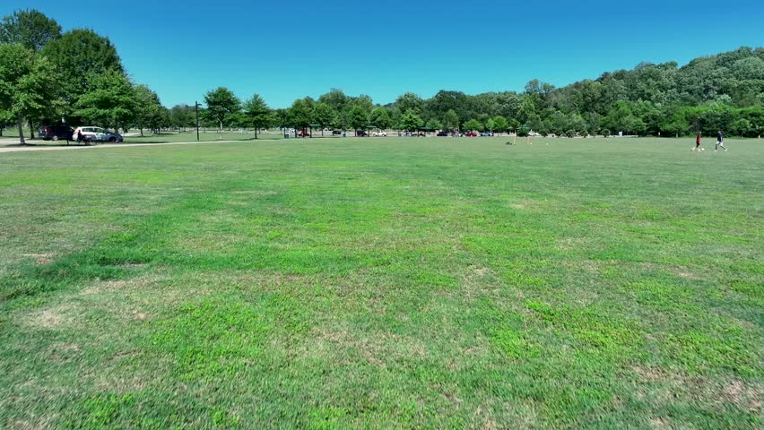 aerial footage of a gorgeous landscape with lush green trees and grass at Etowah River Park in Canton Georgia USA