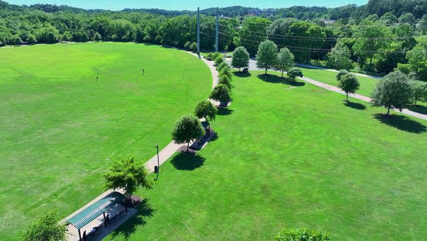 aerial footage of a gorgeous landscape with lush green trees and grass at Etowah River Park in Canton Georgia USA