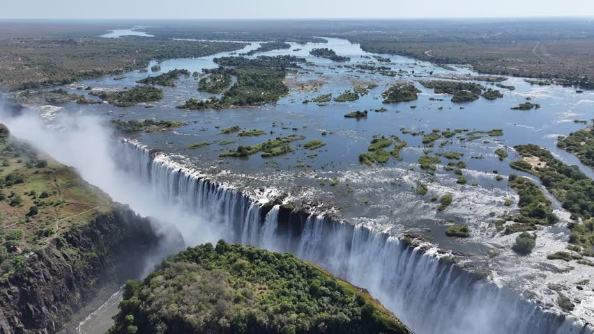 Victoria Falls In Livingstone Northern Rhodesia Zambia. Experience The Majestic Flow Of Waterfalls With Lush Greenery. Idyllic Falls Powerful Waterfall Beauty. Idyllic Travel Nature.