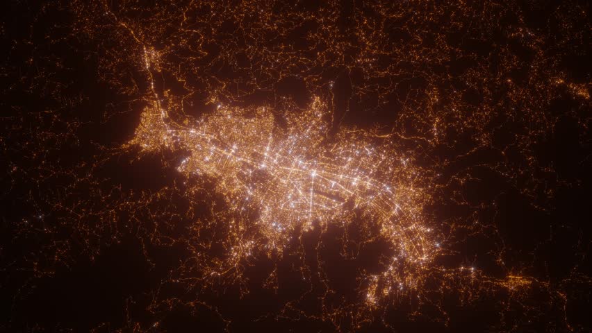 Medellin (Colombia) aerial view at night. Top view on modern city with street lights. Camera is zooming out, rotating clockwise. Vertical video. The north is on the left side