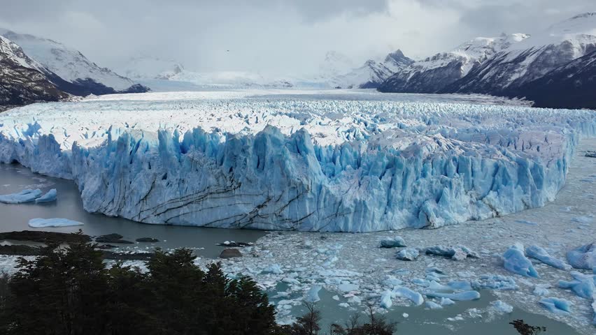 Perito Moreno Glacier In El Calafate Santa Cruz Argentina. Birds Eye View Of Famous Glacier In A Patagonia Landscape. Outdoor Travel Patagonia Glacier. Snow Covered Aerial View Floresta.