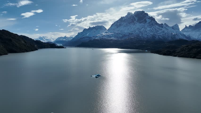 Grey Glacial In Torres Del Paine Punta Arenas Chile. Glacier Calving Into Icy Lagoon With Snow Capped Mountains. Nature Travel Destinations Snow Covered Forest Trees.