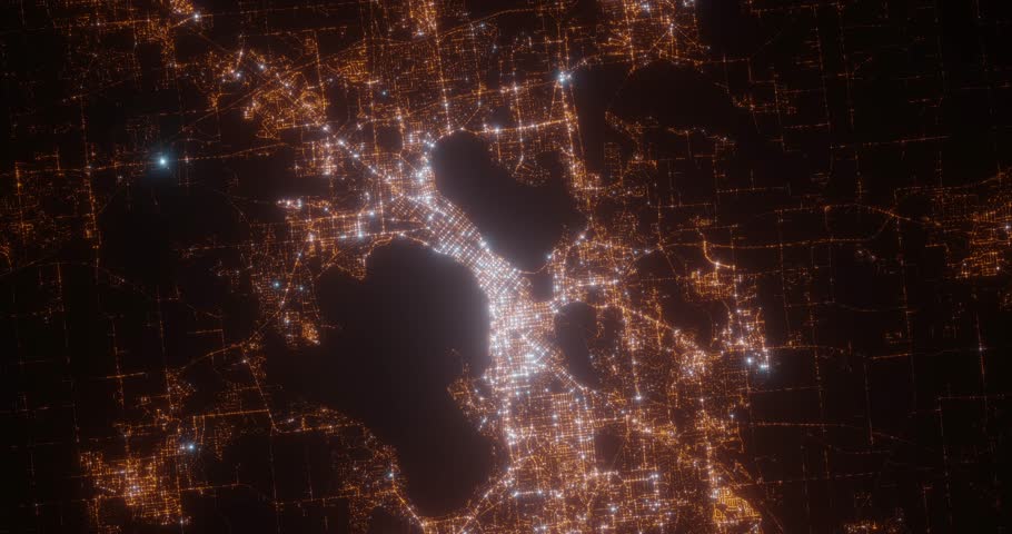 Madison (Wisconsin, USA) aerial view at night. Top view on modern city with street lights. Camera is zooming out, rotating counterclockwise. Vertical video. The north is on the left side