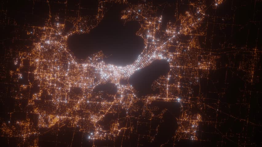Madison (Wisconsin, USA) aerial view at night. Top view on modern city with street lights. Camera is zooming out, rotating clockwise