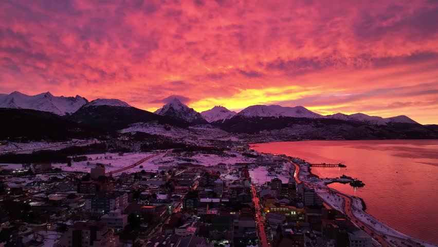 Patagonia Sunrise In Ushuaia Patagonia Argentina. Capturing The Hustle And Bustle Of A Vibrant City From Above. Sunset Snowy Illumination Patagonia Landscape Frozen Background.