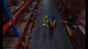 Two warehouse staff entering aisle inspecting shelves as data icons connecting for stock analysis. Industrial, logistics, analytics, inventory, collaboration, technology, storage - Powered by Shutterstock - Get 15% off with code: PIKWIZARD15