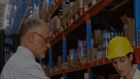 senior man and woman scanning box barcodes activating HUD overlay showing inventory for logistics. Warehousing, logistics, inventory, teamwork, technology, industrial, safety - Powered by Shutterstock - Get 15% off with code: PIKWIZARD15