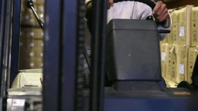 Warehouse forklift operator gripping wheel, activating HUD overlay for scanning, giving thumbs-up. Industrial, logistics, automation, technology, efficiency, warehouse, modern - Powered by Shutterstock - Get 15% off with code: PIKWIZARD15