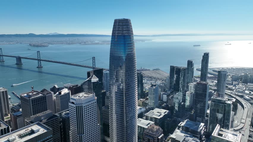 Salesforce Tower In San Francisco California United States. Highrise Building Dominating The Skyline Of The Downtown. Town Clouds Sky Backgrounds Urban. Town Outdoor Panning Wide.
