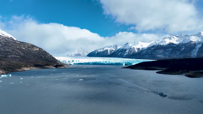 Perito Moreno Glacial In El Calafate Patagonia Argentina. Glacier Calving Into Icy Lagoon With Snow Capped Mountains. Nature Tourism Icon Snow Covered Forest Trees. Nature Discover Aerial.