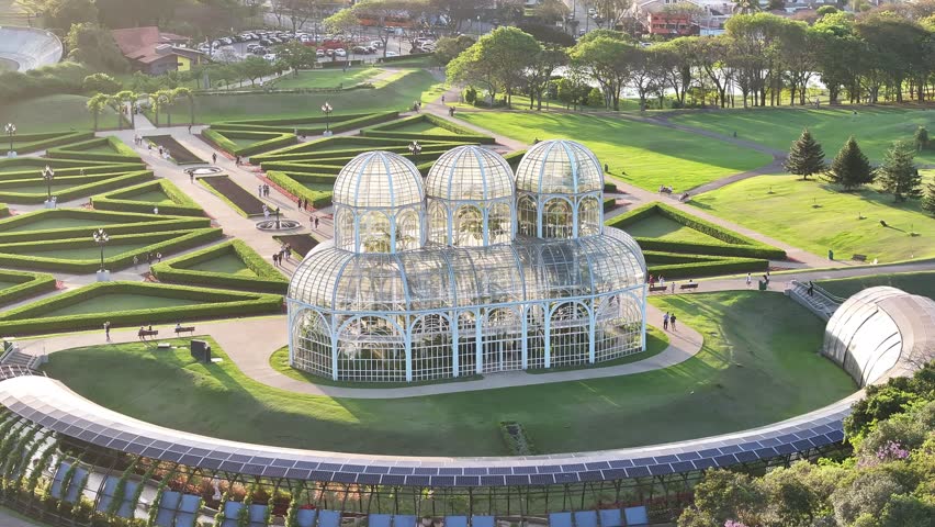 Sunset Botany Garden In Curitiba Parana Brazil. Aerial View Of Green Space Surrounded By Lush Forest Trees. Building Metropolitan Landscape Commercial Building Amazing. Metropolitan Urban.