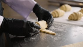 Chef finishes rolling croissant dough in bakery - Powered by Shutterstock - Get 15% off with code: PIKWIZARD15