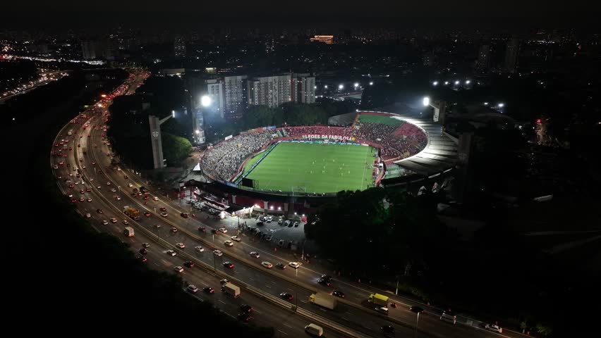 Night Soccer Stadium In Sao Paulo Brazil. Birds Eye View Of Football Field In The Downtown Cityscape. Building Landscape High Rise Building Beautiful.