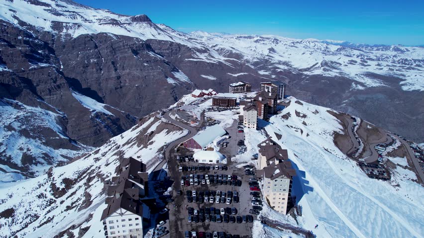 Valle Nevado Ski Station In Andes Mountains Santiago Chile. Chair Lift Transporting Skiers And Snowboarders. Nature Travel Snow Covered Forest Trees. Snow Covered Andes High Angle View.