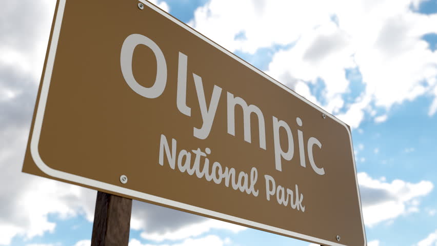 Olympic National Park (Washington) Road Sign Against Blue Sky and Clouds. One of The US National Parks Series.