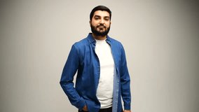 Man stands proudly in a denim shirt, expression calm.	
 - Powered by Shutterstock - Get 15% off with code: PIKWIZARD15