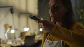 Woman speaking into smartphone using voice command activating tech icons visualizing network growth. Technology, connectivity, innovation, digital, automation, smart, networking - Powered by Shutterstock - Get 15% off with code: PIKWIZARD15