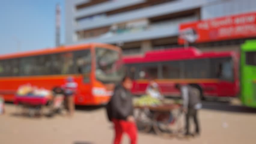 Bokeh view of shuttle bus to Indira Gandhi International Airport in New Delhi, India. Blurred background footage.