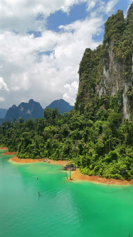 Experience breathtaking and stunning drone footage showcasing the beauty of Phukets crystalclear waters and majestic limestone hills. This tropical paradise is ideal for travel and relaxation