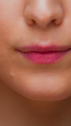 Portrait of Young Woman Eating Sweet Food on Camera. Crop Face of Alone Real Person on Diet Consuming Chocolate Bar as Lunch Snack. Playful Female Human with Sugary Fastfood in Cute Attractive Mouth