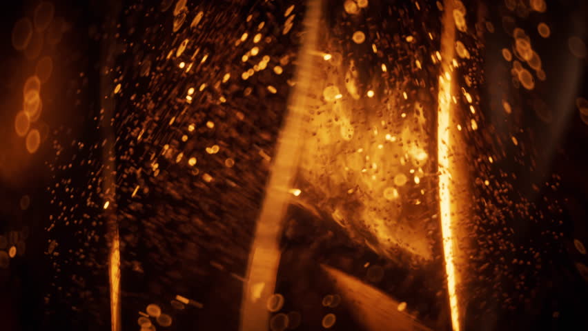 Golden glowing particles in glass geometry, 3d rendering. Motion graphic.
