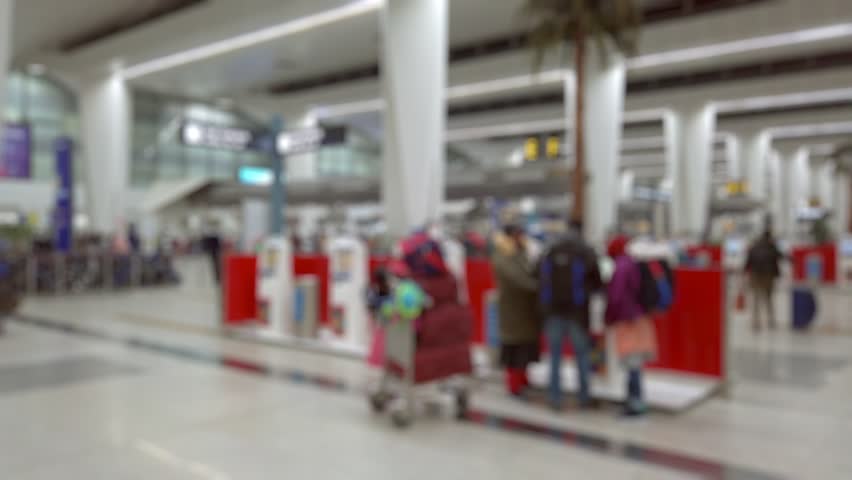 Bokeh view of departure zone of Indira Gandhi International Airport in New Delhi, India. Blurred background footage.