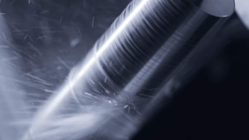 Industrial cnc machine milling metal in highspeed process with sparks