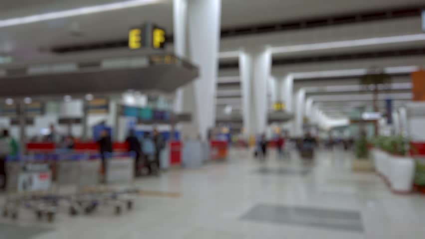 Bokeh view of departure zone of Indira Gandhi International Airport in New Delhi, India. Blurred background footage.