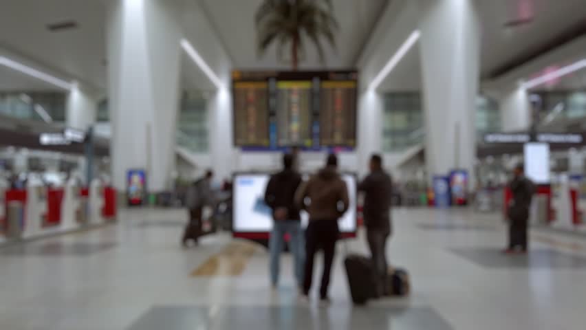 Bokeh view of departure zone of Indira Gandhi International Airport in New Delhi, India. Blurred background footage.