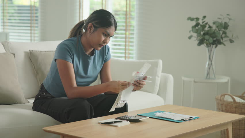 Cost of living low poor budget income black asia people Gen Z young adult woman. Looking opening Past due credit card bill debt home loan money issue asian worry tired stress in raise tax rate crisis.