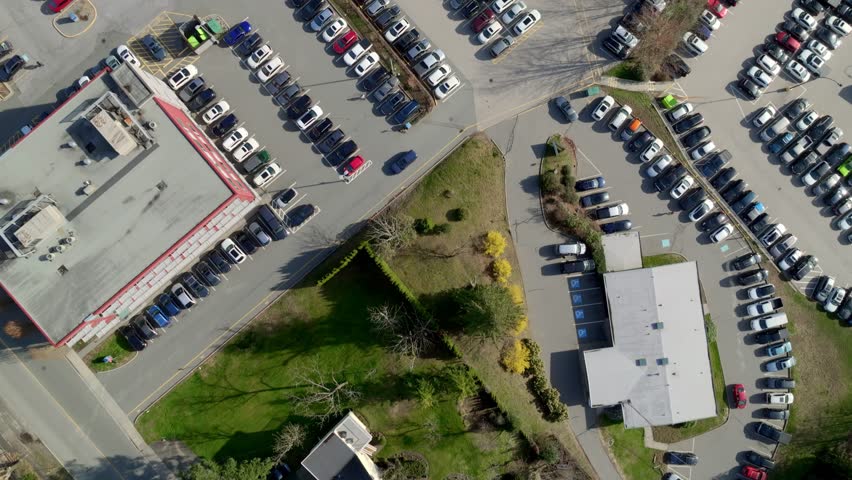 Overhead View Of Cars Parked In The Parking Lots Of Mission Memorial Hospital In BC, Canada. - aerial shot