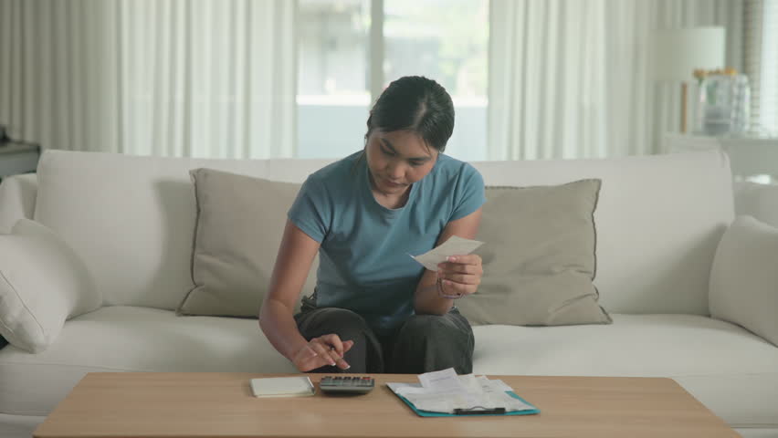 Cost of living income expense saving budget in black asia people Gen Z young adult woman. Looking credit card bill debt home loan money paying happy asian female healthy wealth care goal plan tracking