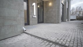 Entrance to modern residential building with minimalist design. Lobby of tall building with large glass doors and lighting in courtyard - Powered by Shutterstock - Get 15% off with code: PIKWIZARD15