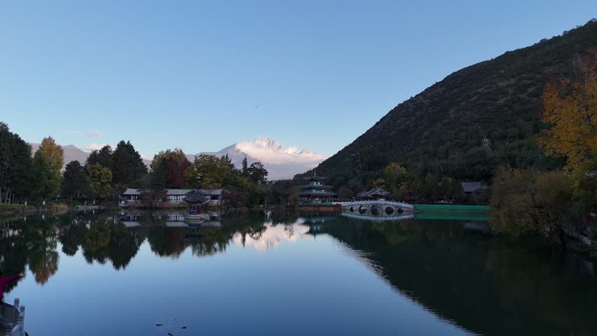 A traditional Chinese pavilion in the middle of the Black Dragon Pond in a public park allows Lijiang residents to exercise in Lijiang, China.