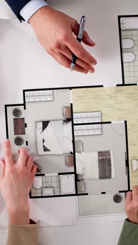 Couple Family Meeting With Real Estate Agent For Advice