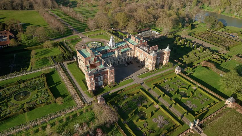 Grand Hatfield house aerial view circling decorative country house estate gardens