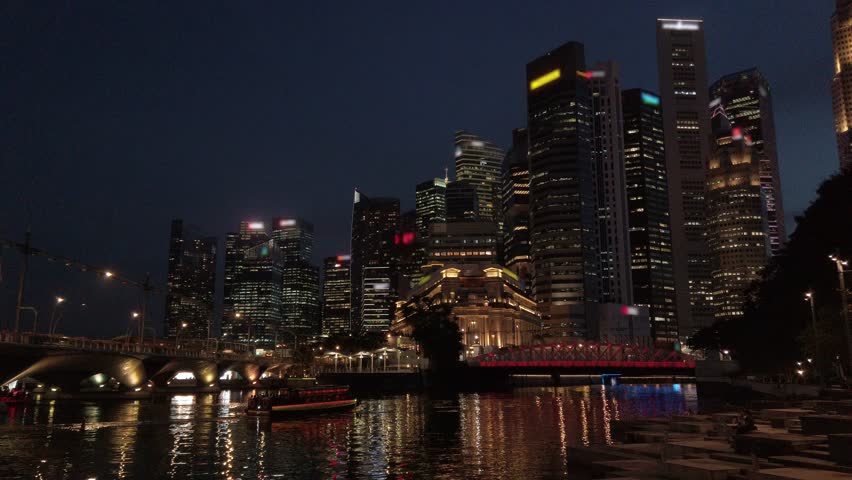 view at marina bay area with many skyscraper business financial building and singapore river in Metropolitan of singapore down town central district in night time,4k video city landscape