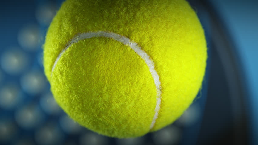 Super Slow Motion Detail Shot of Hitting Padel Ball Towards Camera at 1000 fps.