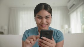 Young adult Gen Z people black asia woman sit at home sofa living room read look at mobile phone relax smile choose lover enjoy play choice right swipe app find love couple AI match flirt chat bot. - Powered by Shutterstock - Get 15% off with code: PIKWIZARD15