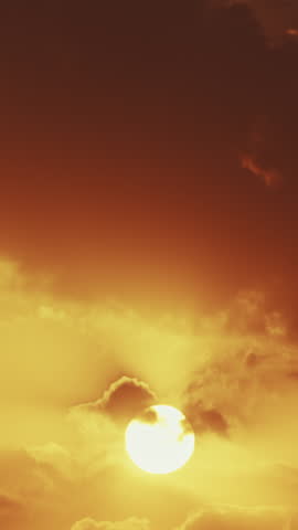 Big Sun Sundown. Bright Dramatic Sunset Sky Natural Background. Sunset Cloudy Sky. Bold Sunset In Yellow, Orange Colors.