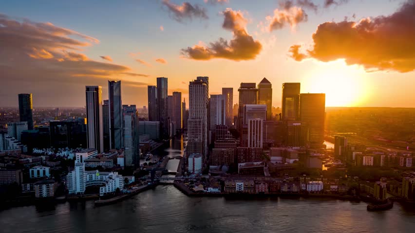 Aerial hyper lapse view of the skyline at the financial district Canary Wahrf in London, England, during sunset time