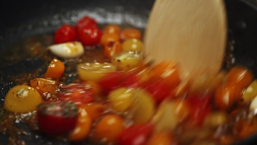 Cherry Tomatoes Gently Sauteing in Hot Skillet.