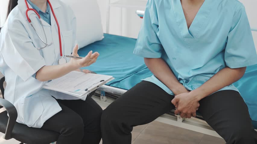 Doctors are providing counseling regarding prostate and venereal cancers that have been detected in a young man. Doctors provide advice and guidance on prostate cancer detection and appropriate treatm