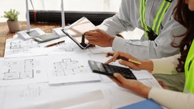 Engineers working as a team using blueprints for architectural plans. Engineers drafting construction project ideas using architect's equipment. Architects talking at a table. Teamwork and constructio - Powered by Shutterstock - Get 15% off with code: PIKWIZARD15