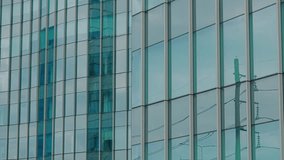 Panoramic upward view of a modern office building with reflective glass facade in a contemporary business district. Captured from street level, emphasizing vertical lines and symmetry. - Powered by Shutterstock - Get 15% off with code: PIKWIZARD15