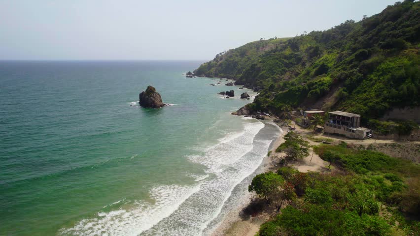 The coastline with clear turquoise waters and rocky formations in la guaira, venezuela, aerial view