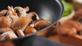 Fresh Royal oyster mushrooms, chef cooking on a wooden cutting board with knife in cafe asian restaurant kitchen, vibrant scene of food preparation - Powered by Shutterstock - Get 15% off with code: PIKWIZARD15