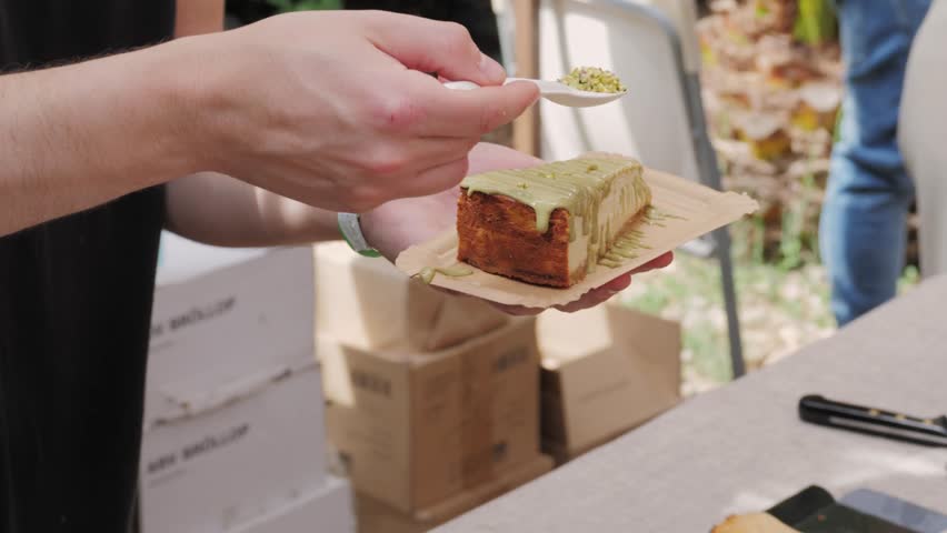 Close up of tasty San Sebastian or Basque Cheesecake slice with jam on a table. High quality 4k footage