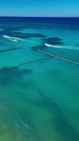 Aerial view of speedboats on the turquoise ocean