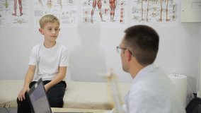 Pediatric consultation in a medical office with a doctor and a small child present - Powered by Shutterstock - Get 15% off with code: PIKWIZARD15